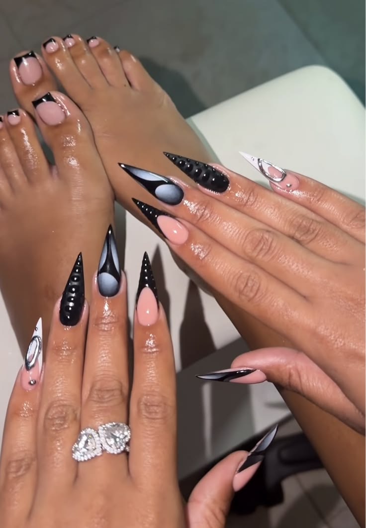 Nail technician applying nail art on dark skin hands